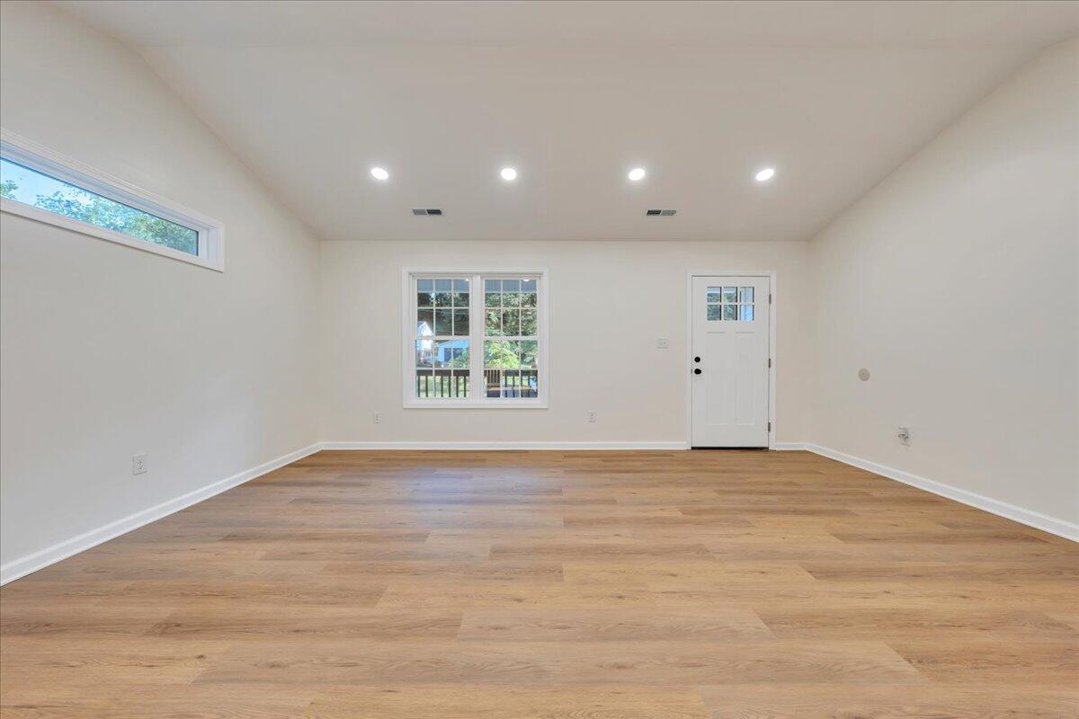3713 Pinevale Road Roanoke, VA 24018 - Photo 16 of 46 a view of an empty room with wooden floor and a window