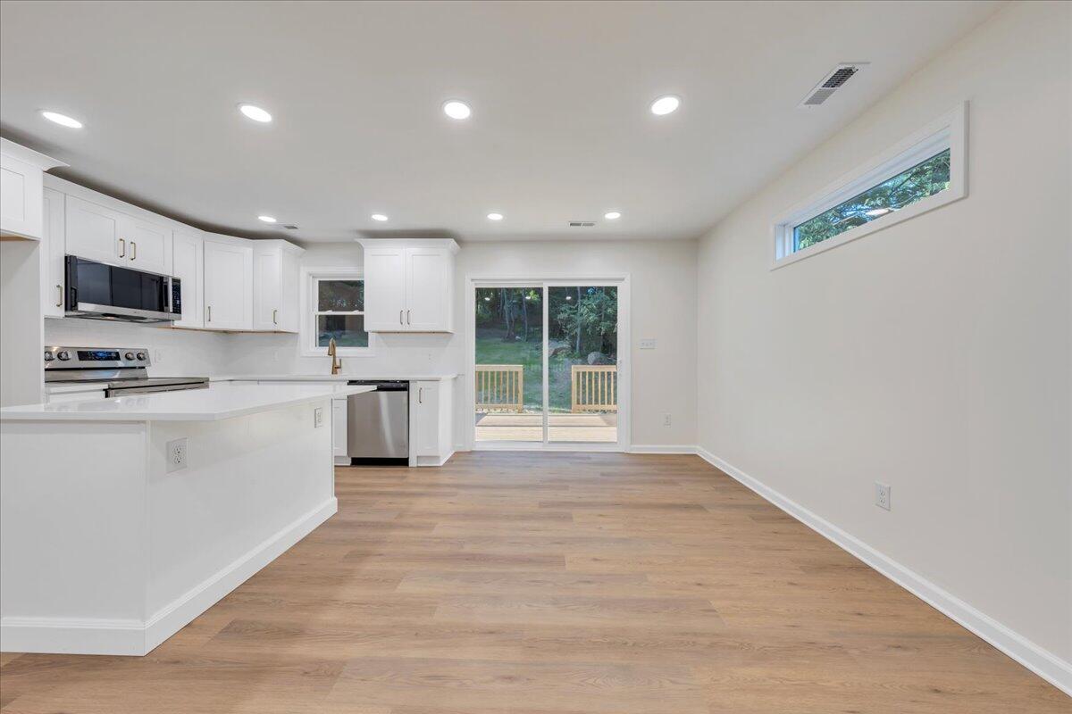 3713 Pinevale Road Roanoke, VA 24018 - Photo 18 of 46 a kitchen with stainless steel appliances granite countertop a stove a sink and a refrigerator