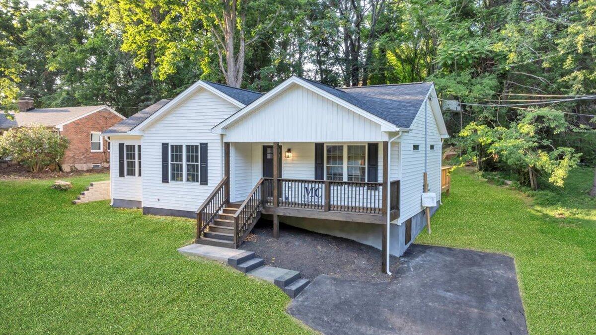 3713 Pinevale Road Roanoke, VA 24018 - Photo 2 of 46 a view of a house with a yard and large trees