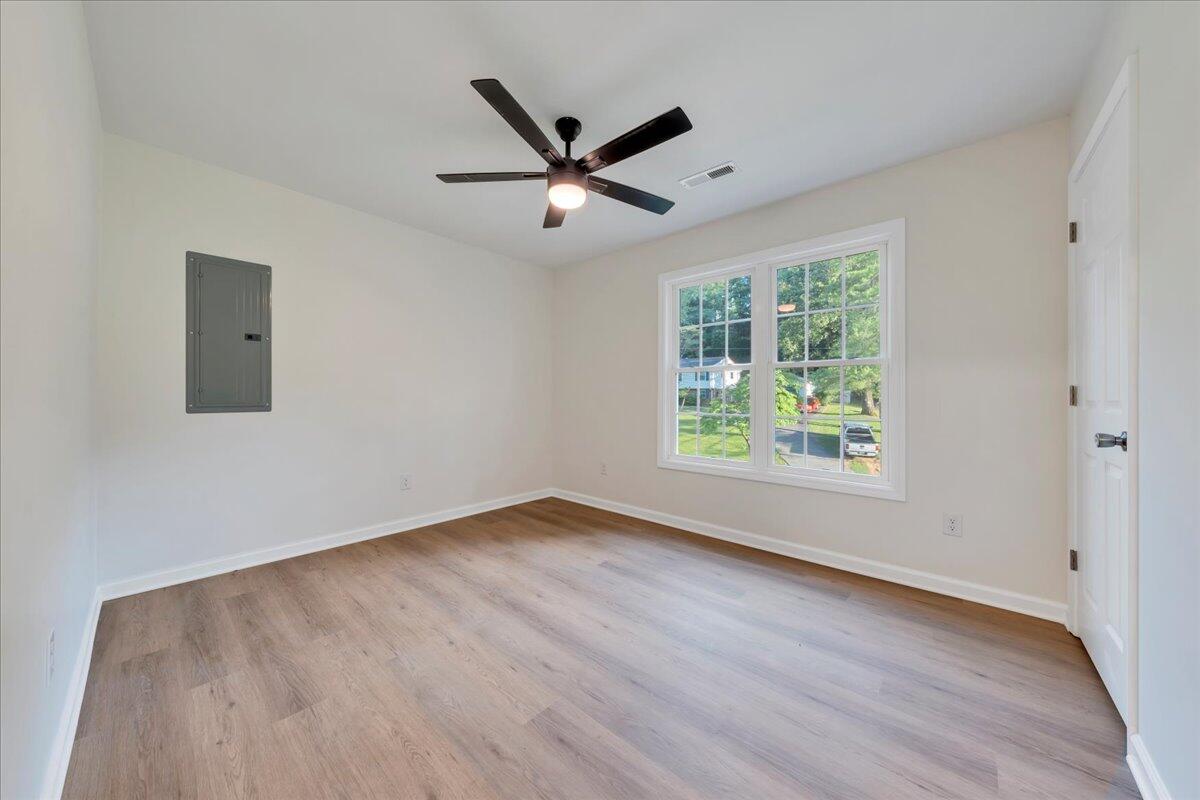 3713 Pinevale Road Roanoke, VA 24018 - Photo 23 of 46 a view of an empty room with wooden floor and a window