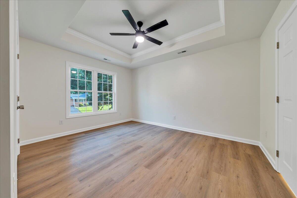 3713 Pinevale Road Roanoke, VA 24018 - Photo 27 of 46 an empty room with wooden floor and windows