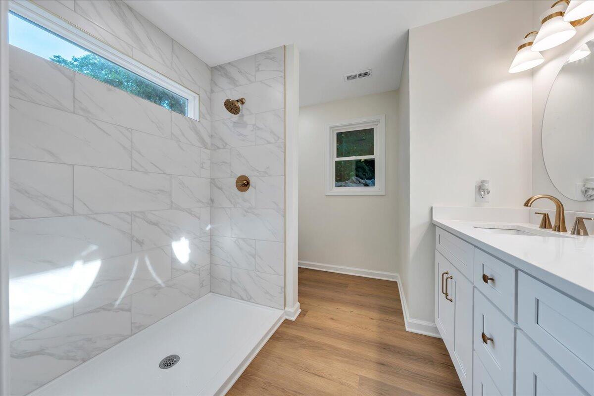 3713 Pinevale Road Roanoke, VA 24018 - Photo 30 of 46 a bathroom with a double vanity sink and mirror