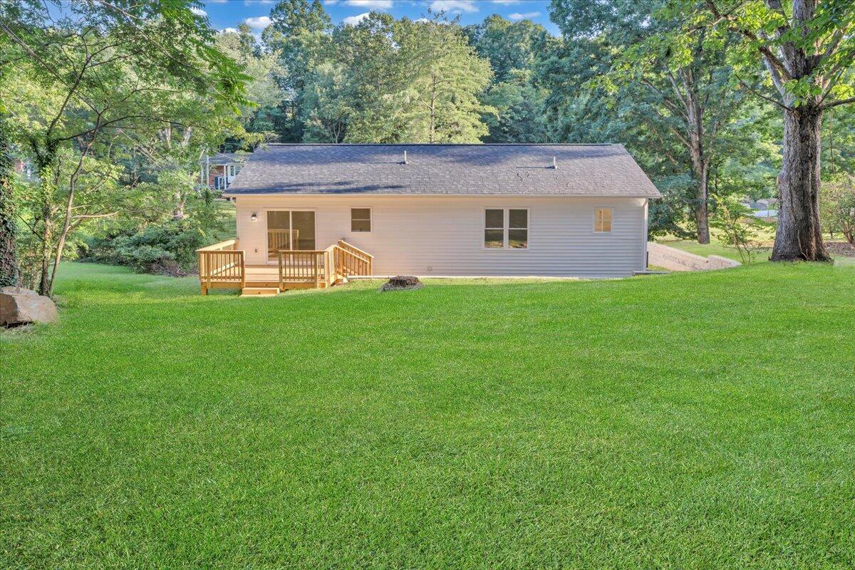 3713 Pinevale Road Roanoke, VA 24018 - Photo 36 of 46 a front view of a house with a garden and yard