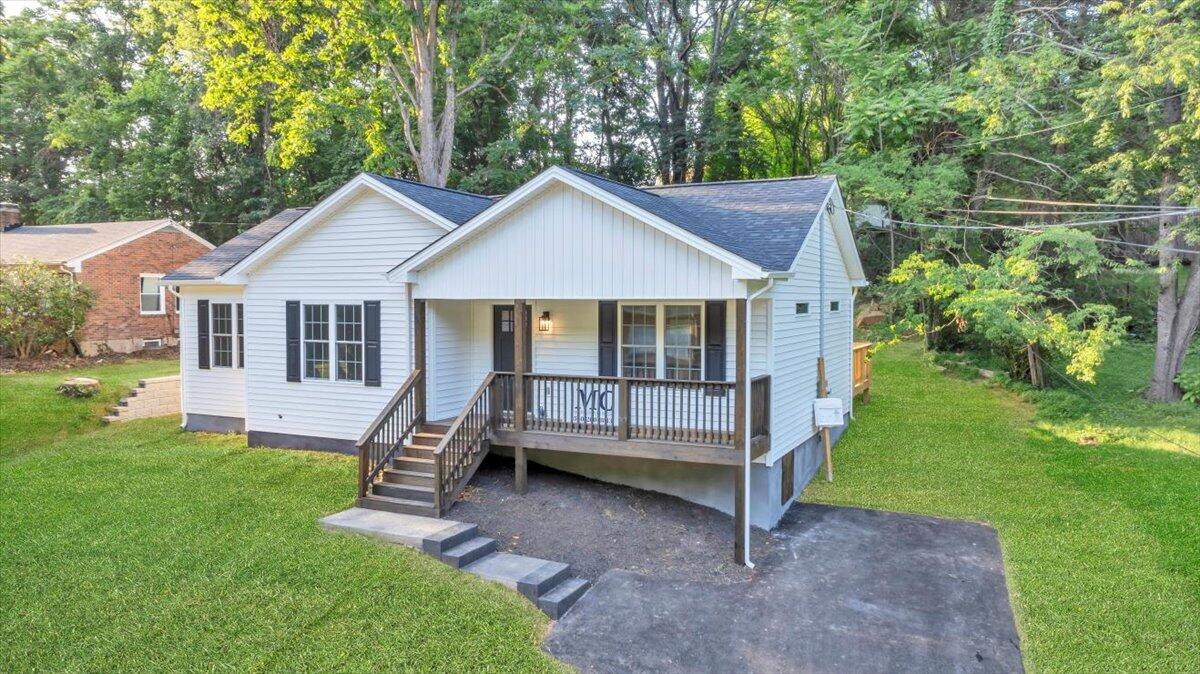 3713 Pinevale Road Roanoke, VA 24018 - Photo 40 of 46 a front view of a house with a yard table and chairs