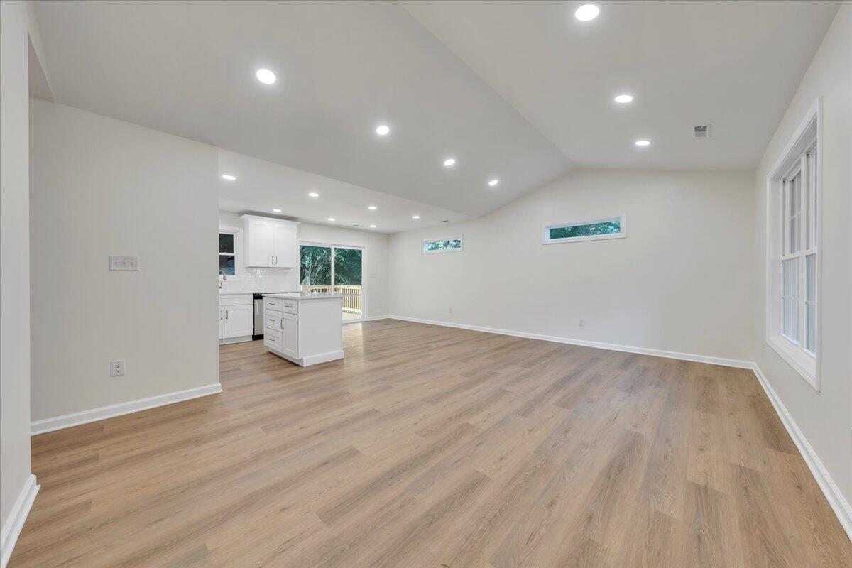 3713 Pinevale Road Roanoke, VA 24018 - Photo 4 of 46 a view of a big room with wooden floor and windows