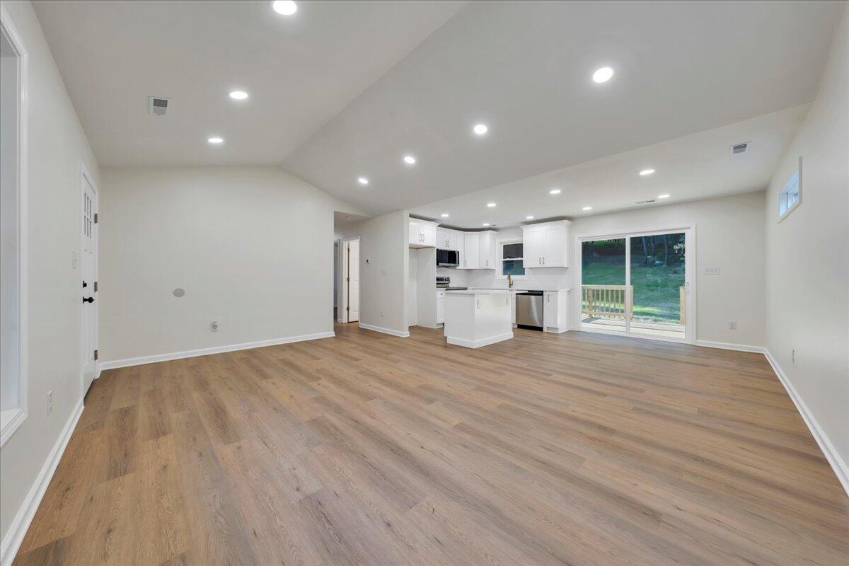 3713 Pinevale Road Roanoke, VA 24018 - Photo 5 of 46 a view of empty room with wooden floor and window