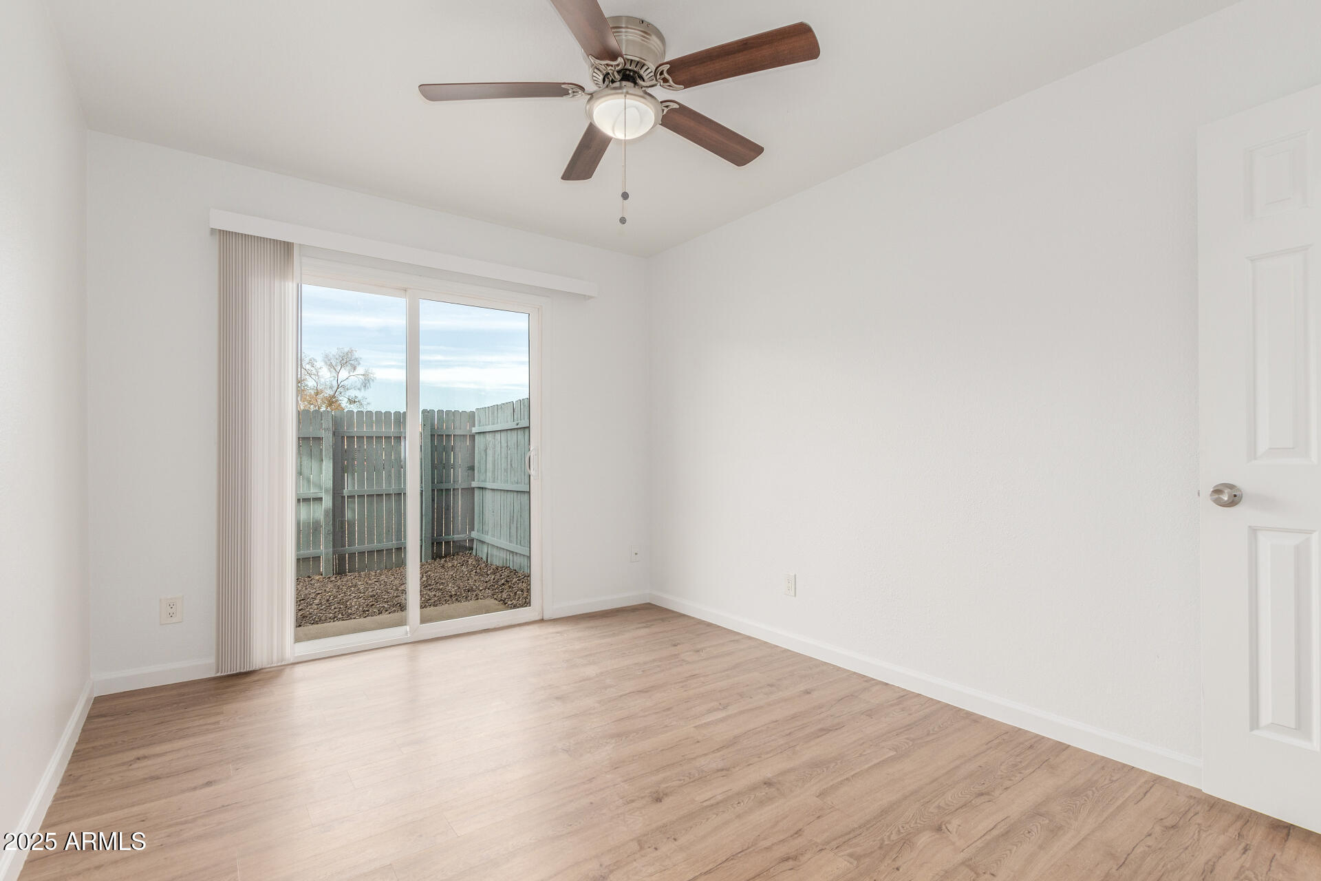 1346 East Mountain View Road, Unit 207 Phoenix, AZ 85020 - Photo 21 of 29 an empty room with wooden floor and windows