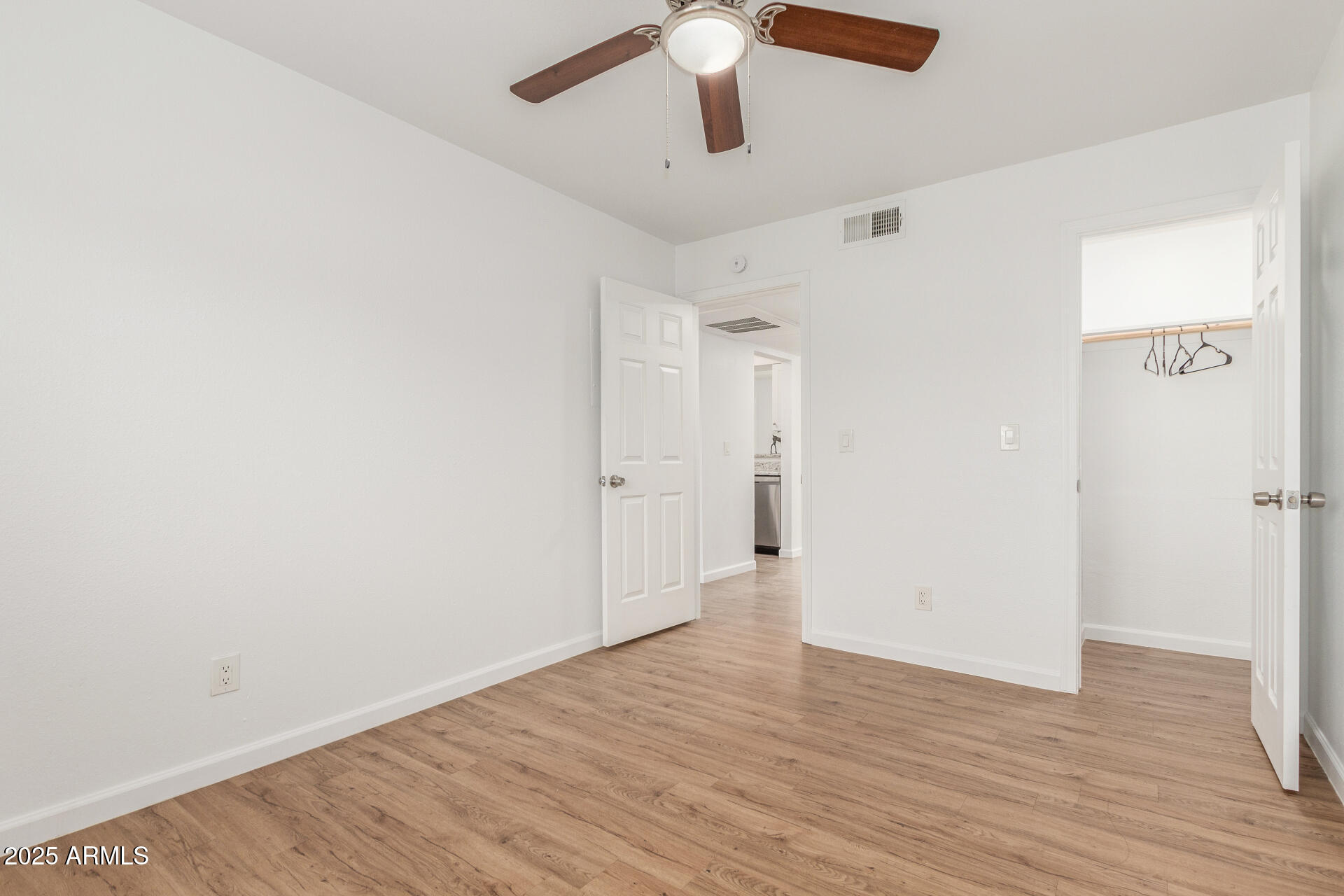 1346 East Mountain View Road, Unit 207 Phoenix, AZ 85020 - Photo 26 of 29 a view of an empty room with wooden floor