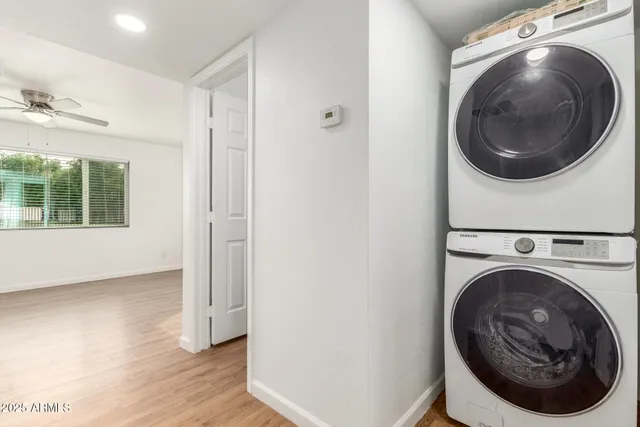 a view of a hallway with washer and dryer