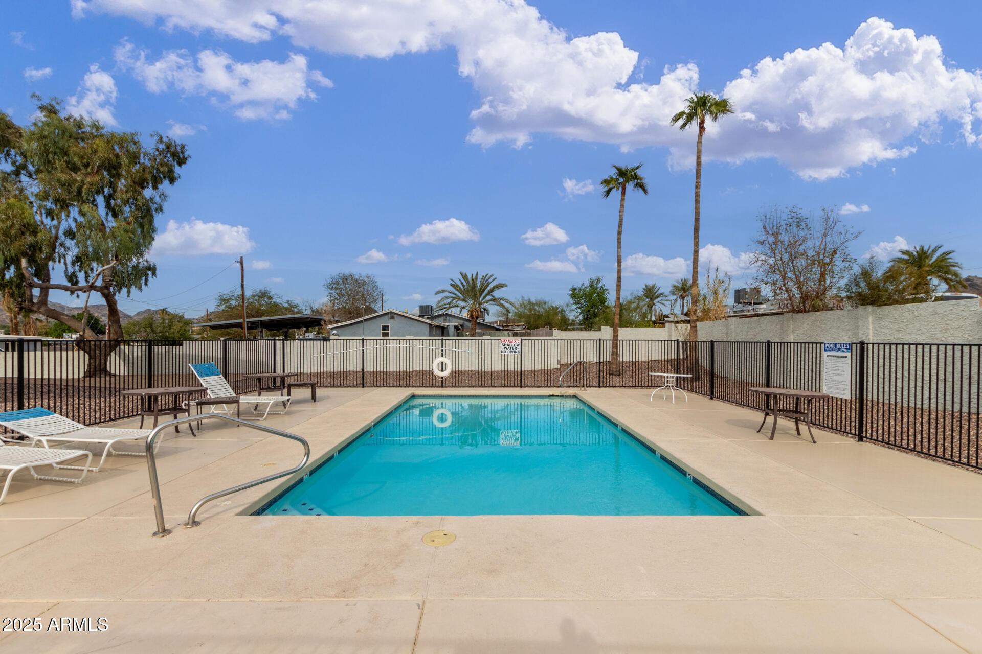 1346 East Mountain View Road, Unit 207 Phoenix, AZ 85020 - Photo 29 of 29 a view of a swimming pool with chairs