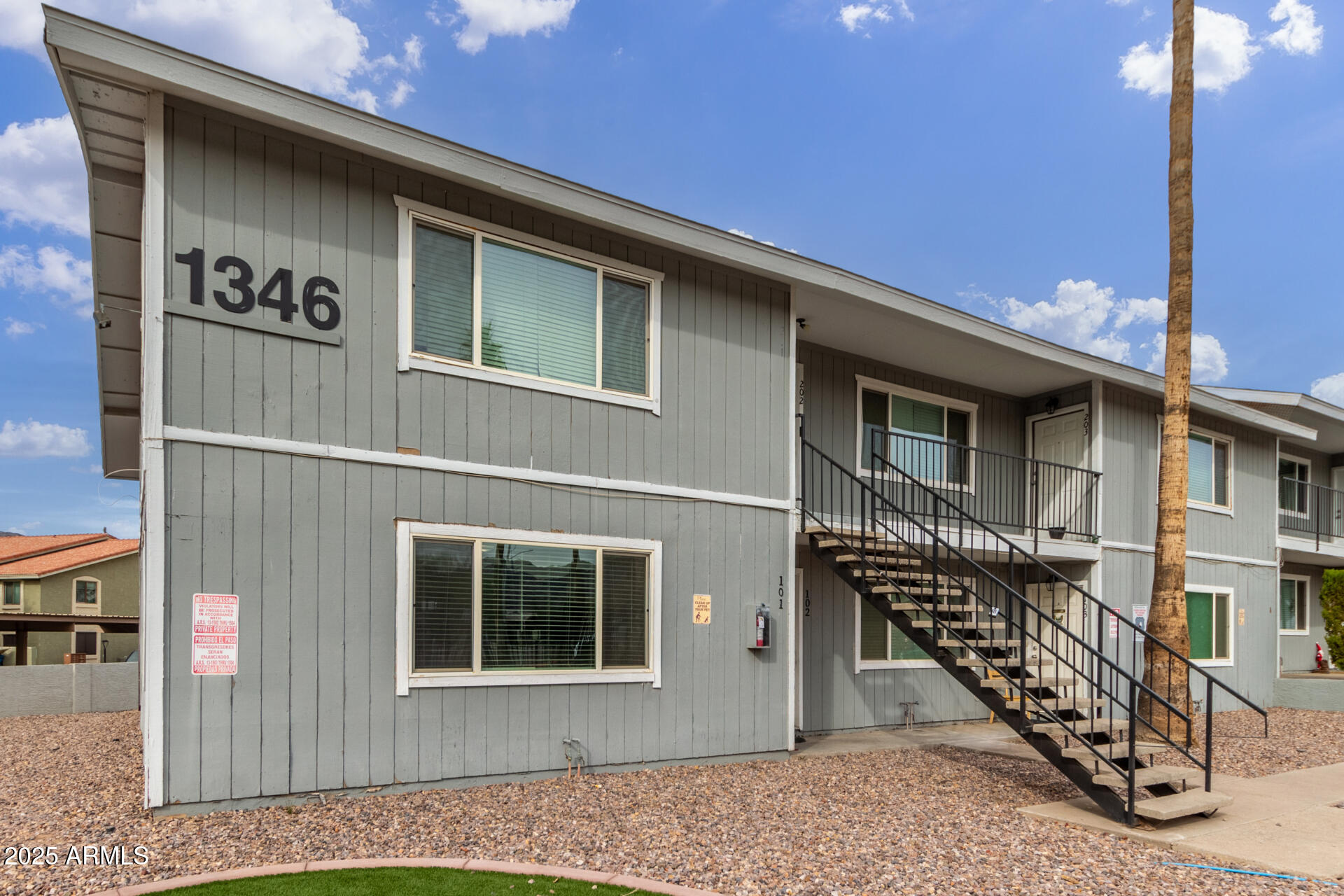 1346 East Mountain View Road, Unit 207 Phoenix, AZ 85020 - Photo 10 of 29 a front view of a house with wooden stairs