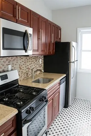 a kitchen with a stove and a microwave