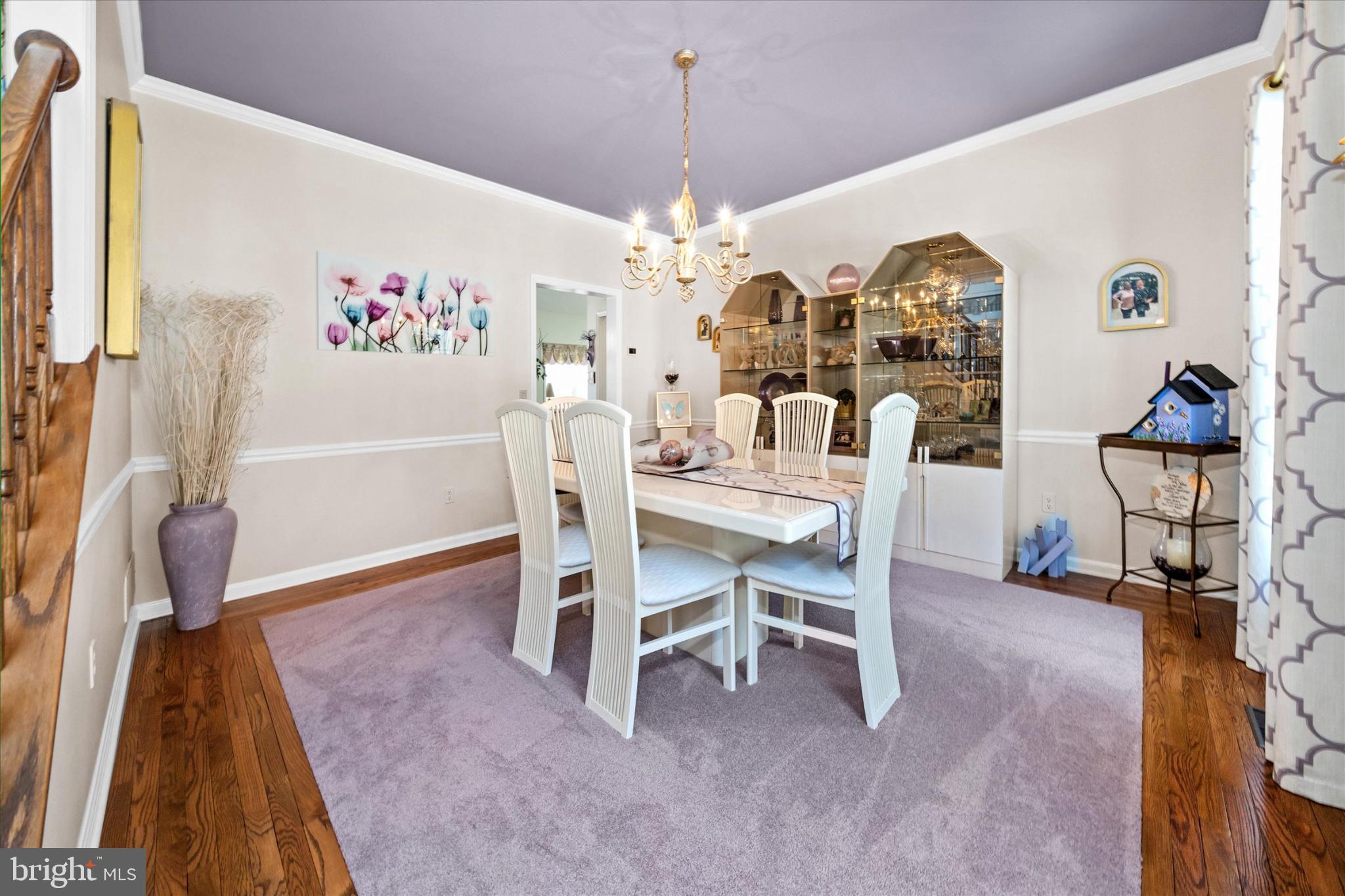 7 Pierson's Ridge Hockessin, DE 19707 - Photo 12 of 59 a view of a dining room with furniture and chandelier