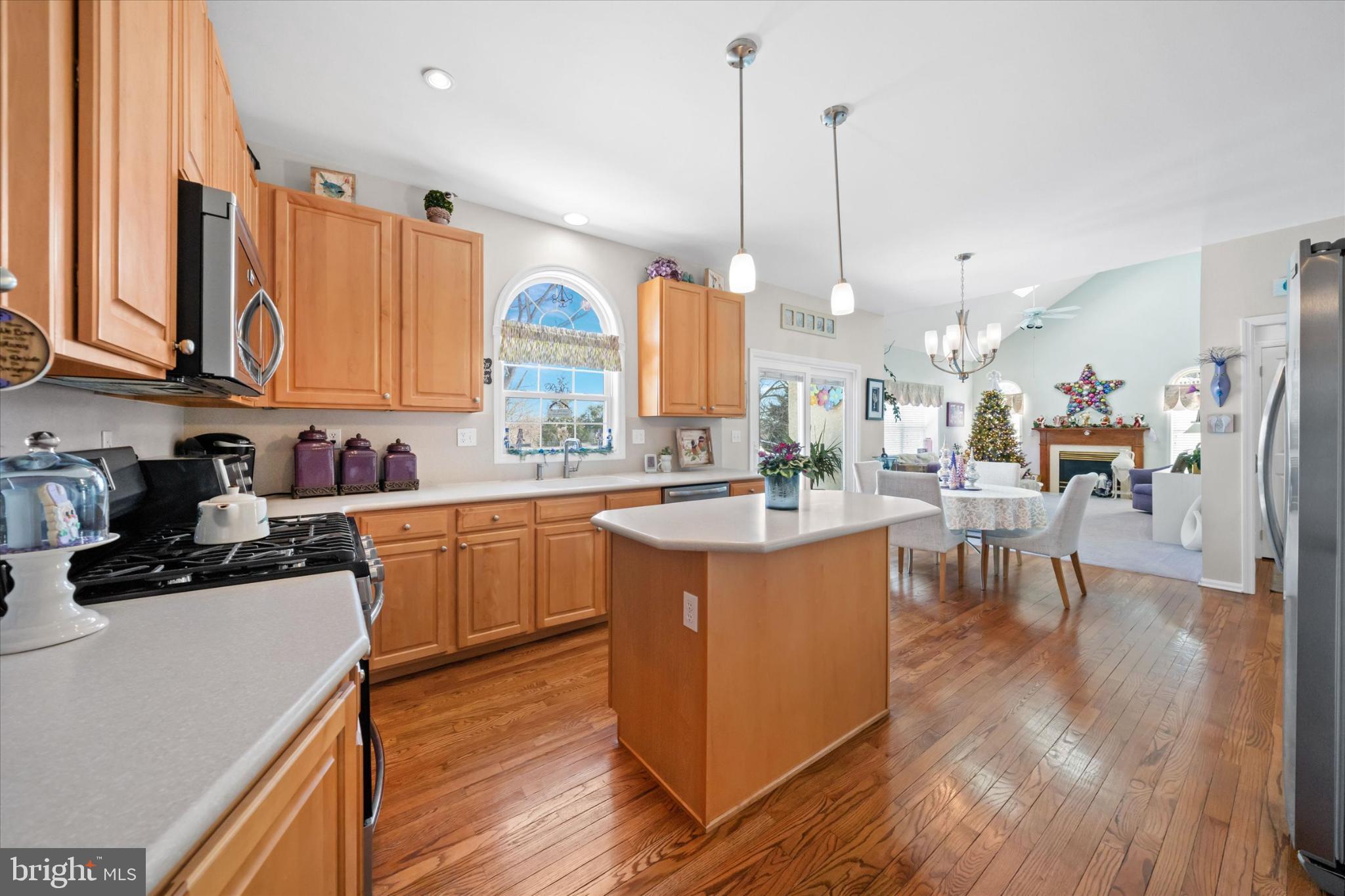 7 Pierson's Ridge Hockessin, DE 19707 - Photo 14 of 59 a kitchen with stainless steel appliances granite countertop wooden floors sink and cabinets