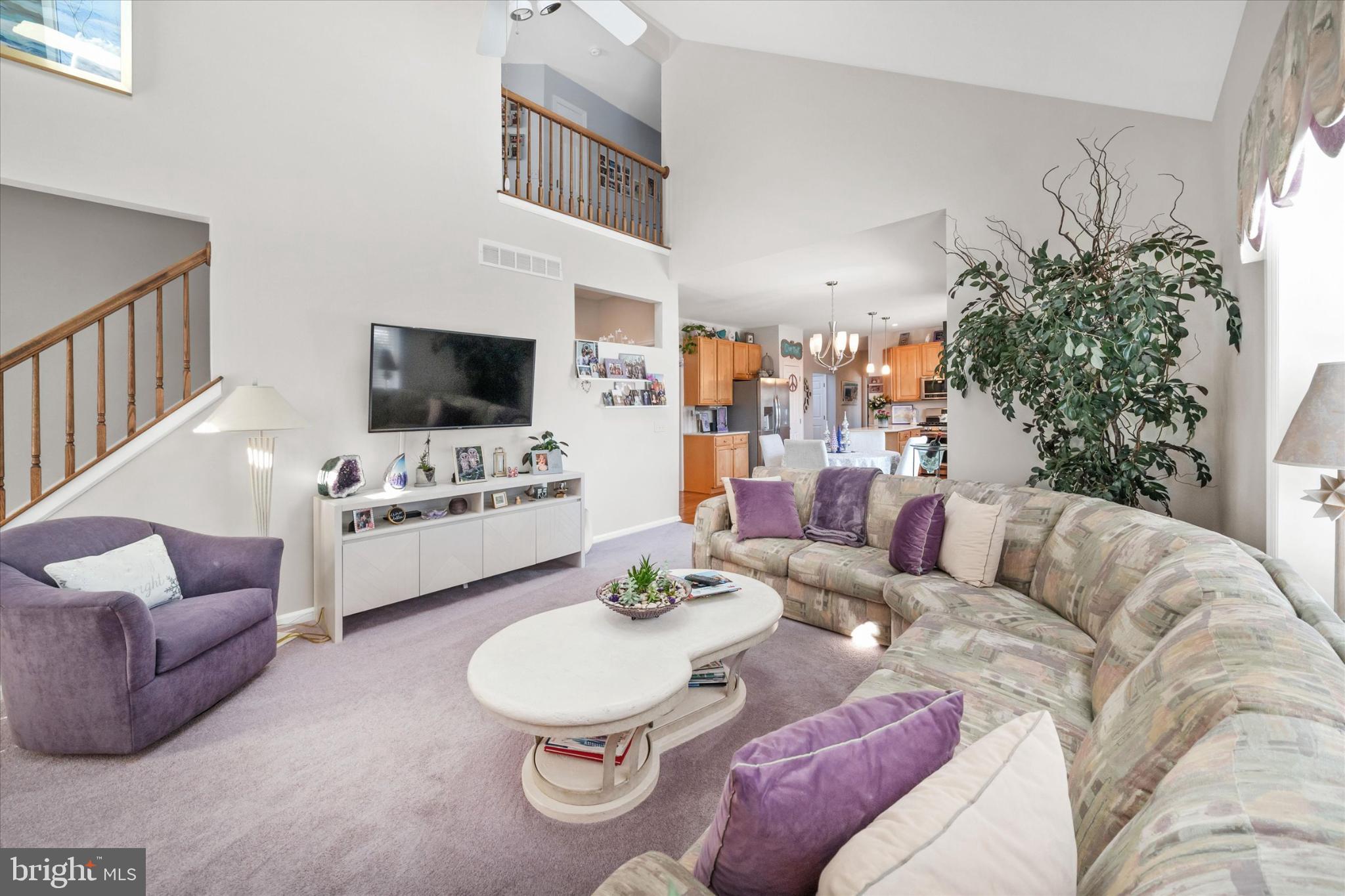 7 Pierson's Ridge Hockessin, DE 19707 - Photo 17 of 52 a living room with furniture and a flat screen tv
