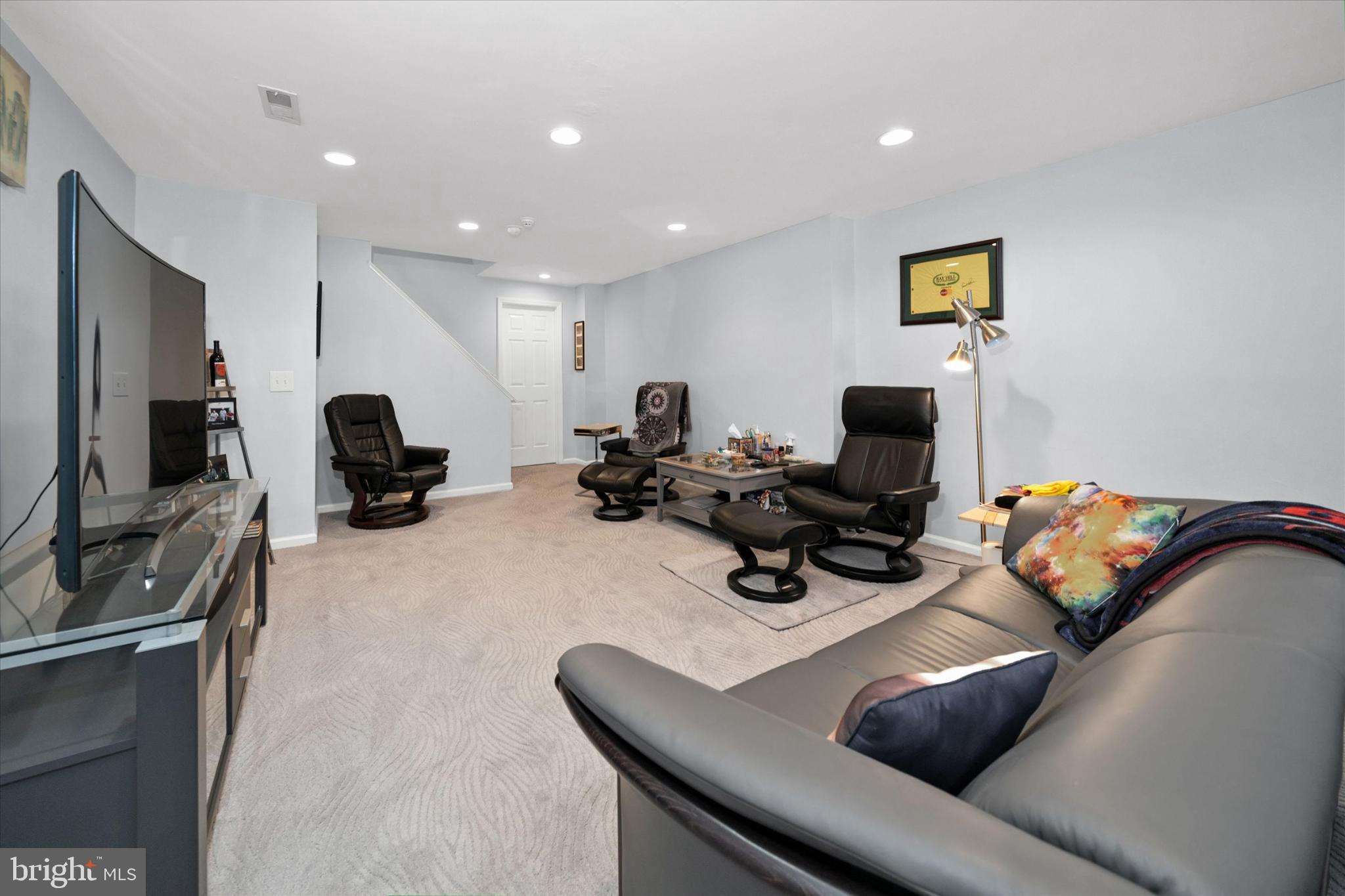 7 Pierson's Ridge Hockessin, DE 19707 - Photo 36 of 52 a living room with furniture and a flat screen tv