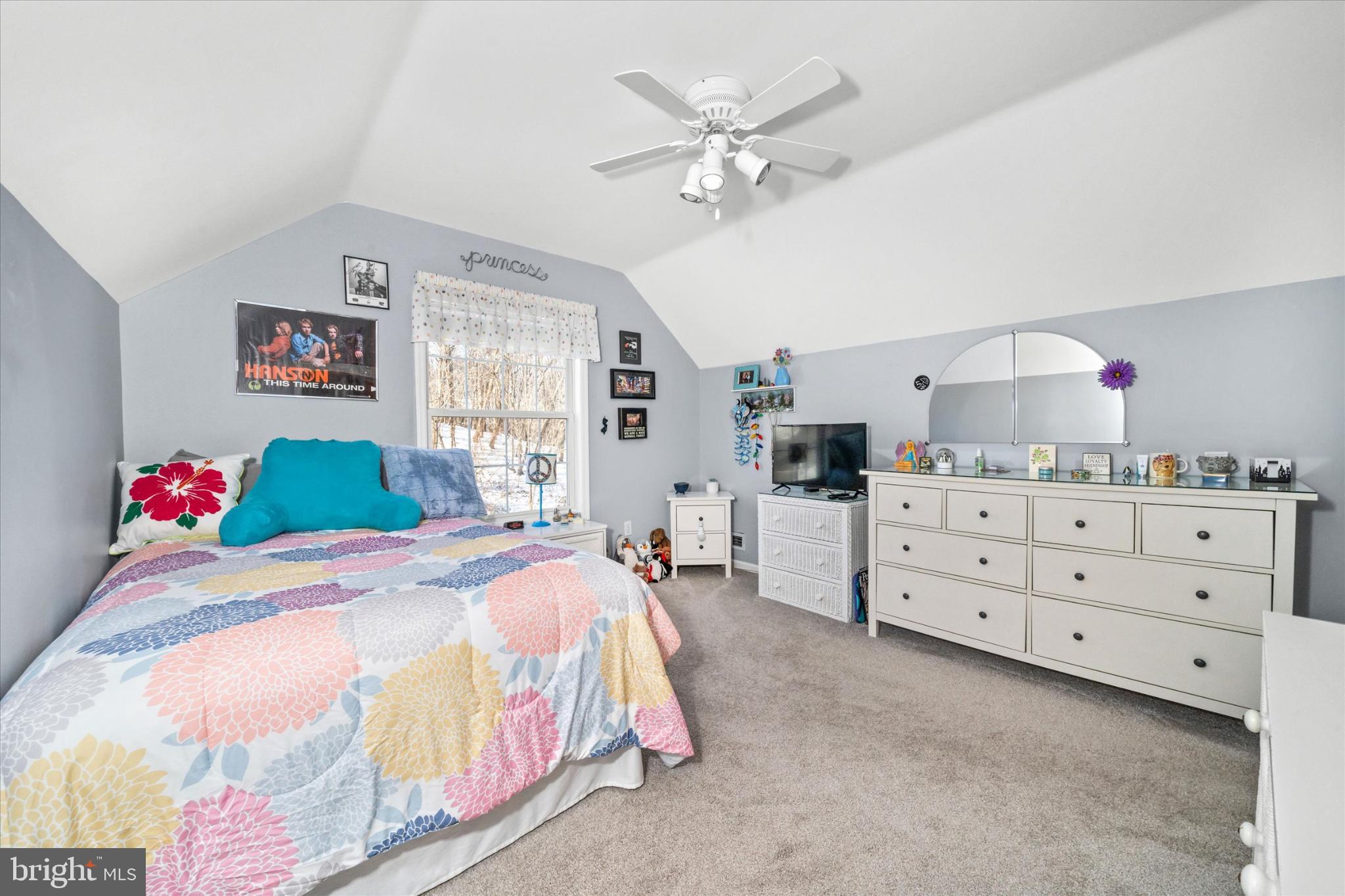 7 Pierson's Ridge Hockessin, DE 19707 - Photo 37 of 59 a bedroom with a bed and a chandelier