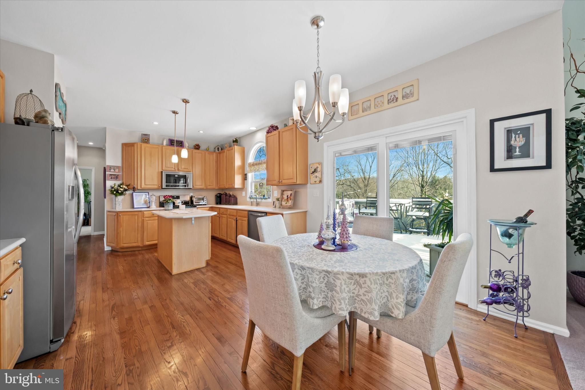 7 Pierson's Ridge Hockessin, DE 19707 - Photo 4 of 52 a view of a dining room and livingroom with furniture wooden floor a chandelier