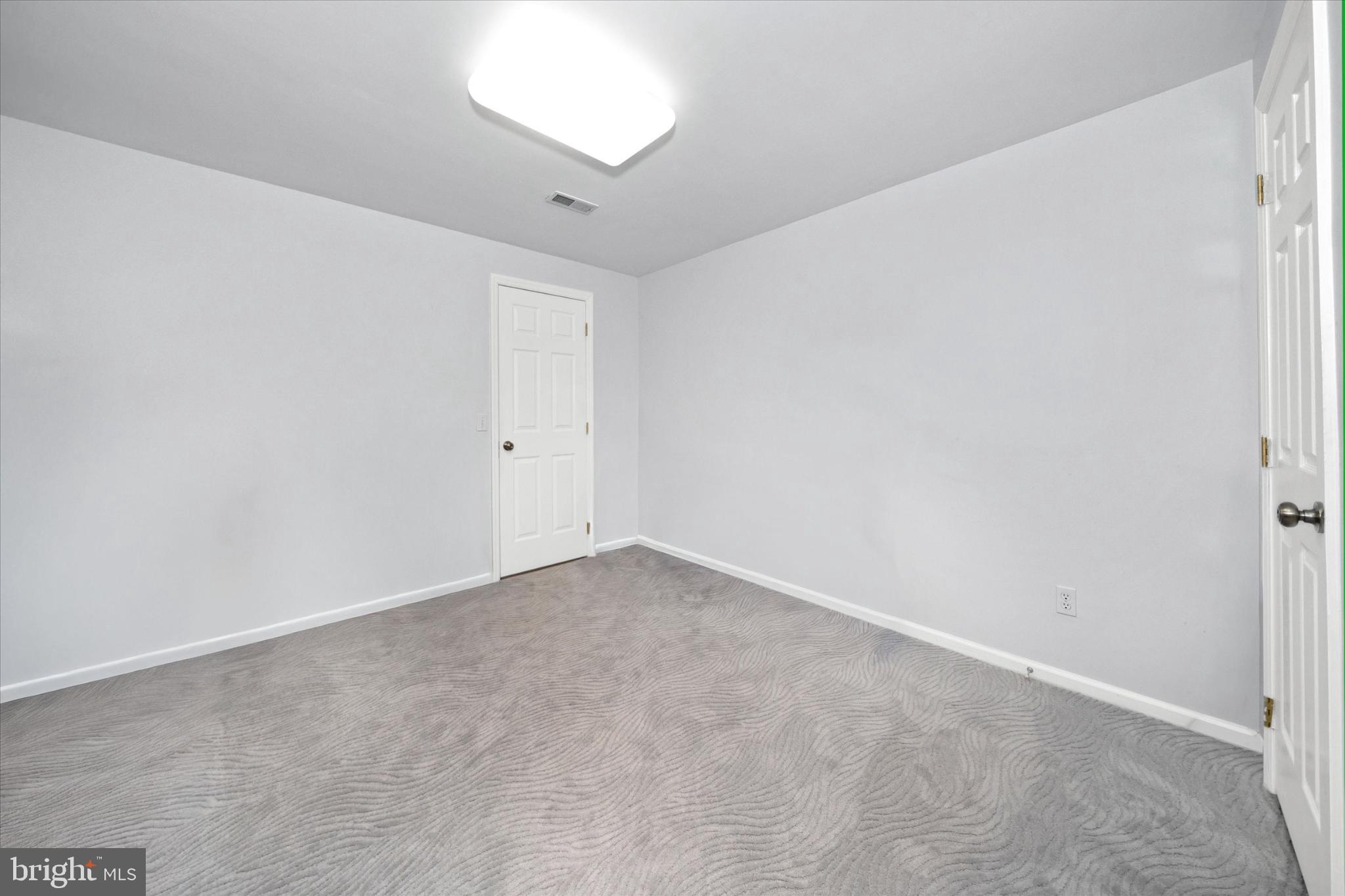 7 Pierson's Ridge Hockessin, DE 19707 - Photo 42 of 59 an empty room with a empty space and a window