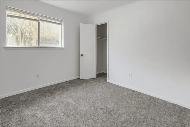 an empty room with windows