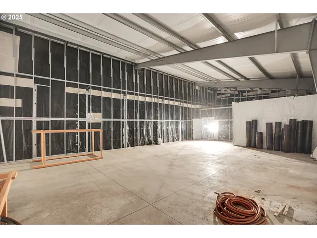 a view of a livingroom with table and chairs