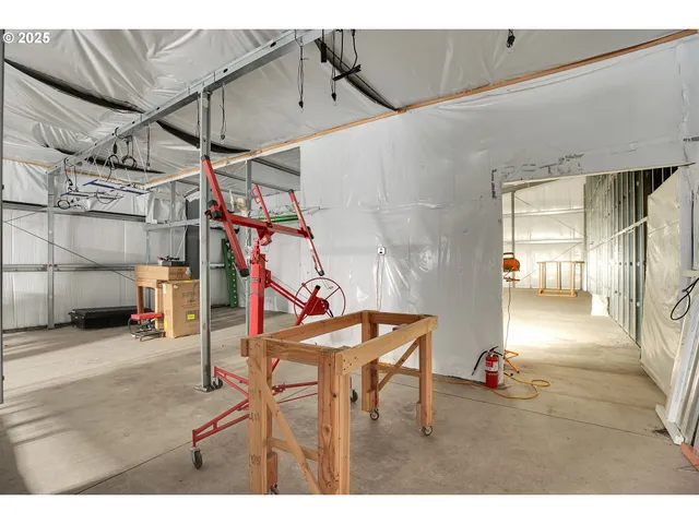 a view of a livingroom with furniture and a flat screen tv