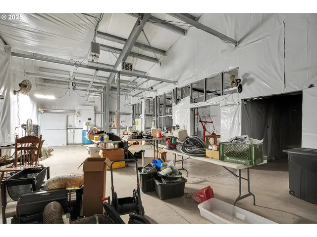 a living room with lots of furniture and a chandelier
