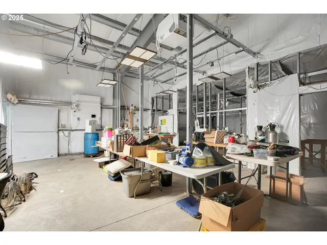 a living room with lots of furniture and a chandelier