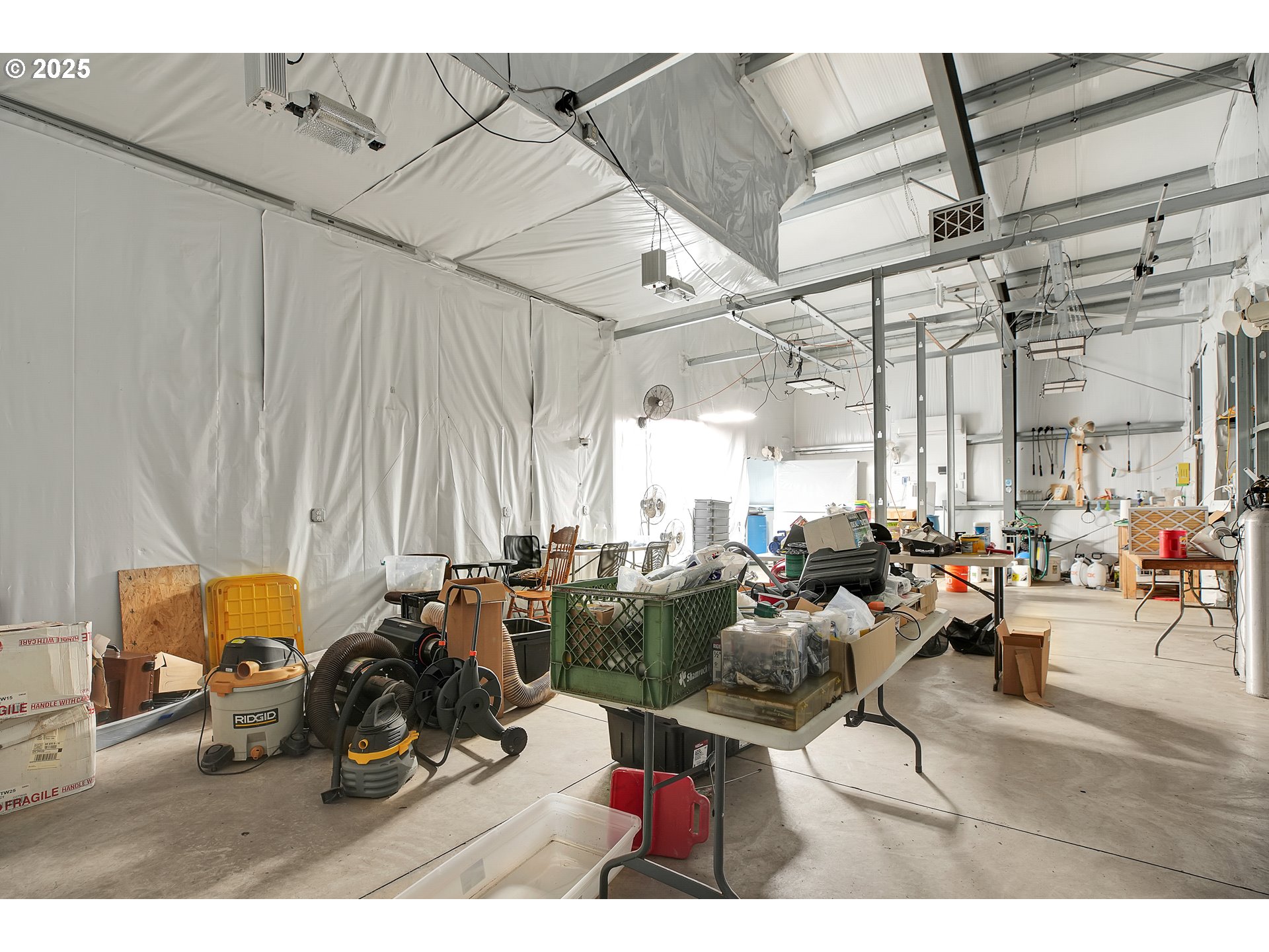 29100 Zimmerman Road Rainier, OR 97048 - Photo 20 of 48 a living room with lots of furniture and a chandelier