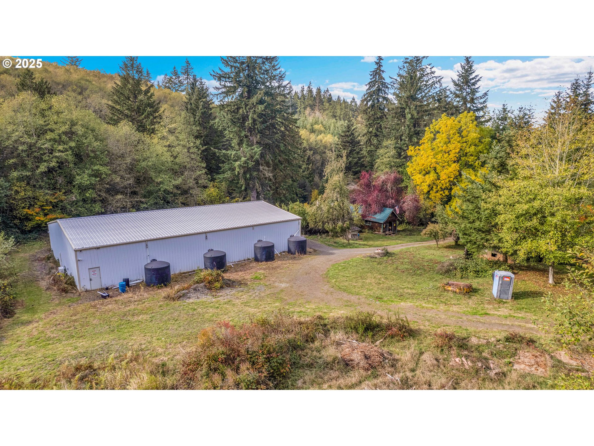 29100 Zimmerman Road Rainier, OR 97048 - Photo 35 of 48 a view of a house with a yard