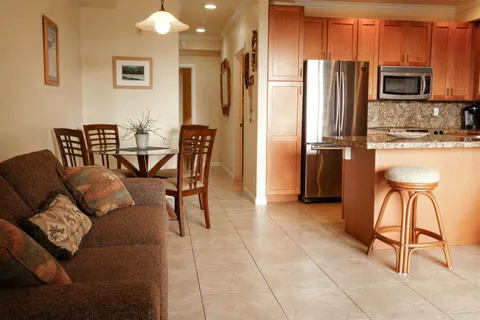 a blue couch sitting in front of a window