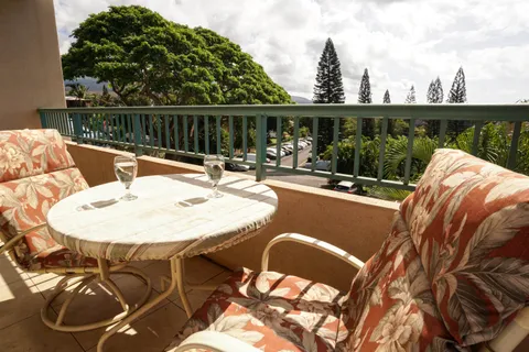 a bedroom with two beds and a table