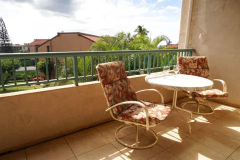 a bedroom with two beds and a table