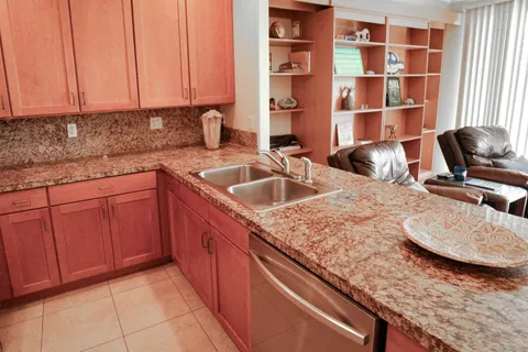 a kitchen with a table chairs and a refrigerator
