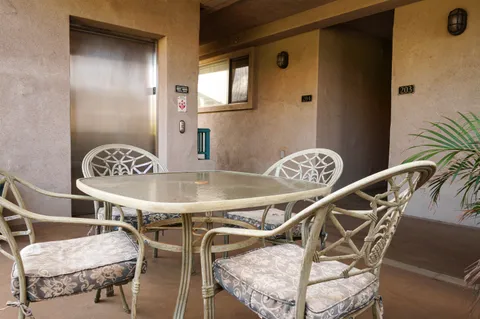 a kitchen with stainless steel appliances granite countertop a sink and dishwasher wooden cabinets with granite countertops