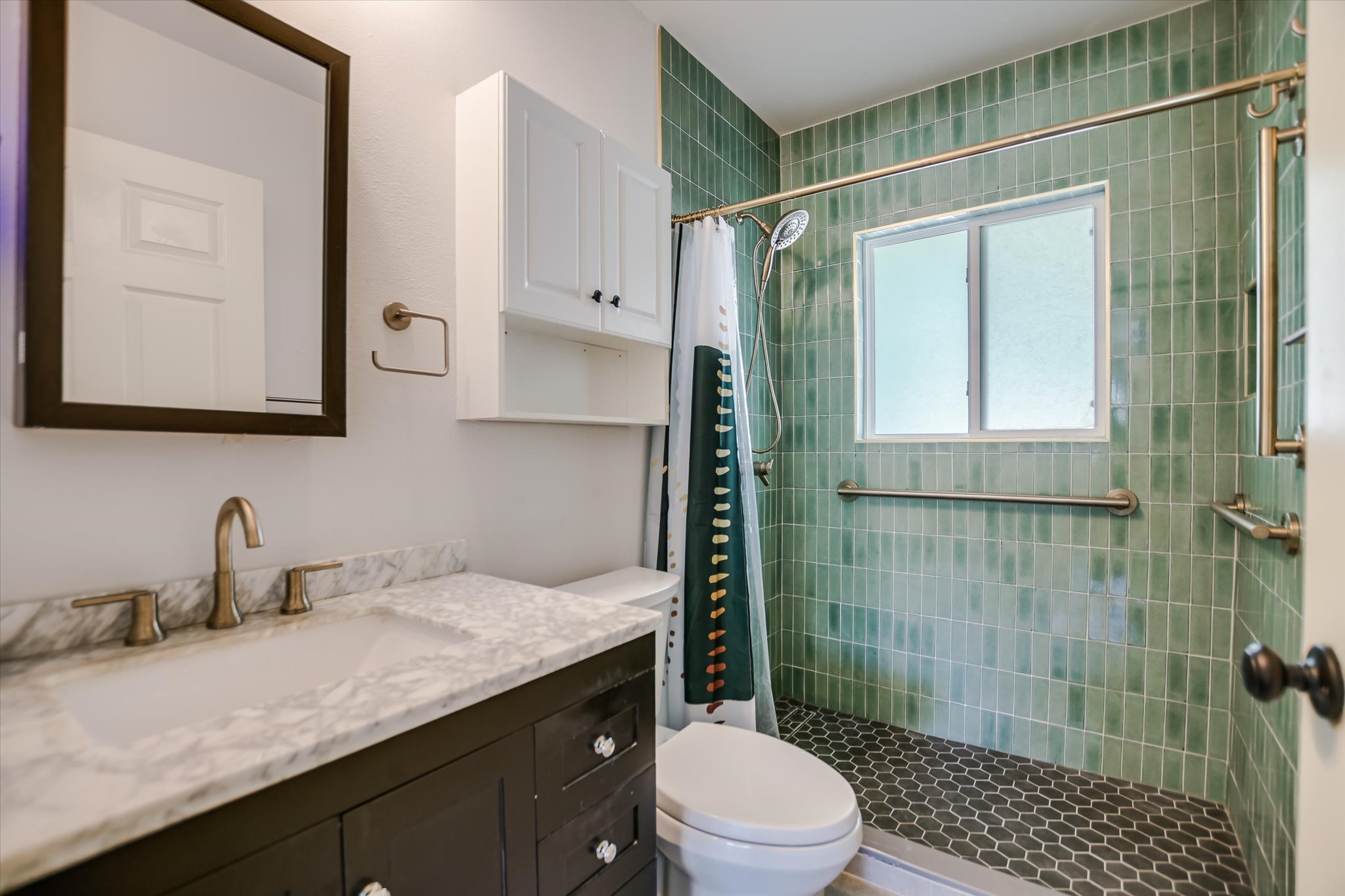 1601 East 19th Street Georgetown, TX 78626 - Photo 21 of 31 a bathroom with a sink a toilet and shower