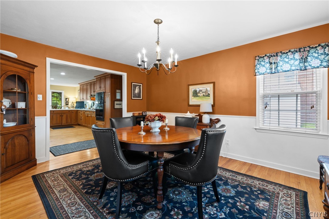 410 Meadow Road Geddes, NY 13219 - Photo 9 of 50 Enjoy special meals in this formal dining room, with chair rail.