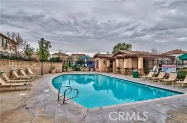 a view of a swimming pool with a lounge chairs