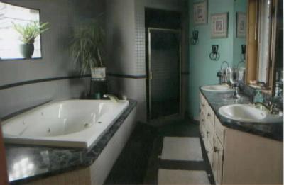 3363 Coville Road Allentown, PA 18104 - Photo 8 of 8 a bath tub sitting next to a bathroom sink
