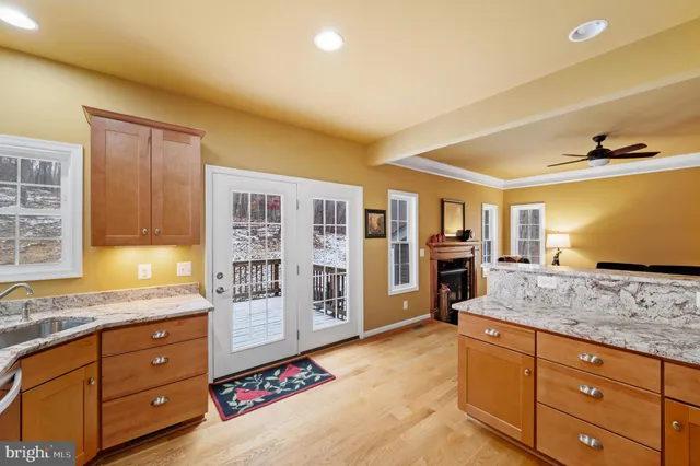 a bed room with a bed and a ceiling fan