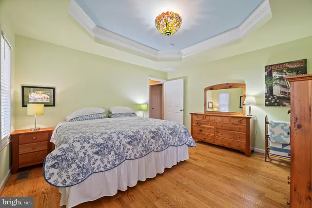 a living room with furniture a rug and a wooden floor