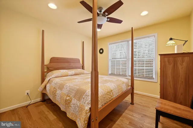 a view of a room with furniture and wooden floor