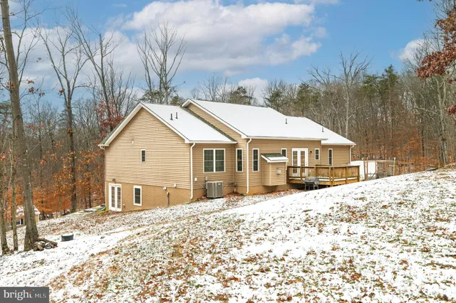 a view of a yard with snow on the road