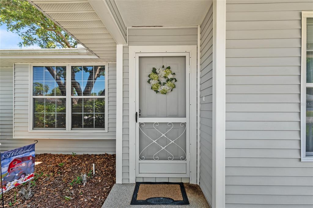 8038 Southwest 108th Loop Ocala, FL 34481 - Photo 2 of 48 a view of front door of house