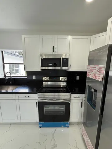 a bathroom with a tub and a shower