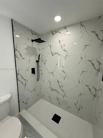 an empty room with a empty space and windows