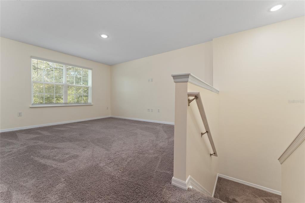 4331 Wayne Road Fruitland Park, FL 34731 - Photo 26 of 46 a view of hallway with stairs