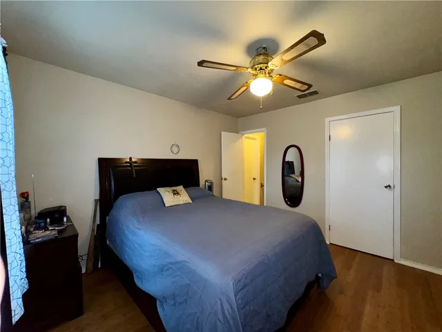 a bedroom with a bed and a closet