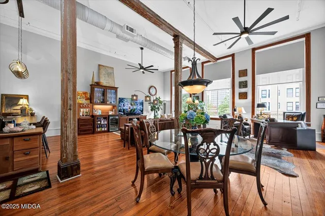 a view of a dining room with furniture window and wooden floor