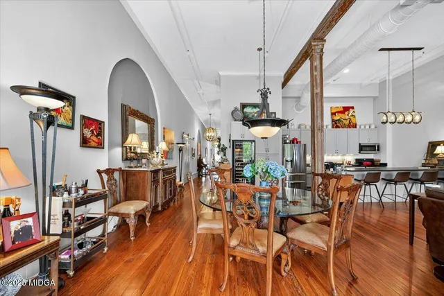 a living room with lots of furniture and a chandelier